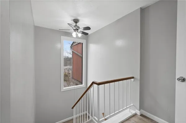a view of entryway with a chandelier fan
