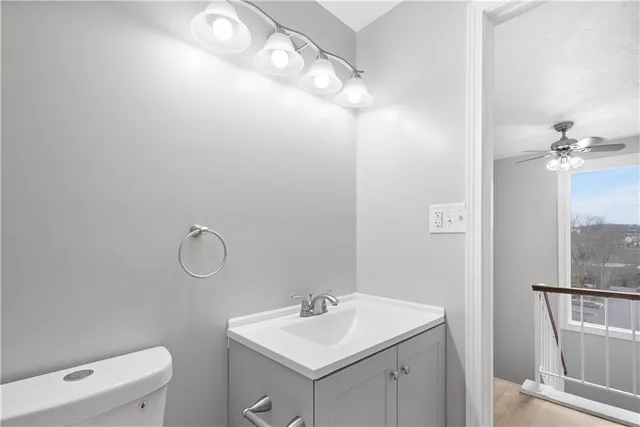 a bathroom with a sink vanity and a mirror