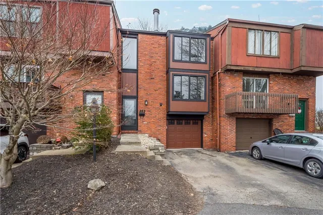 a car parked in front of a brick building