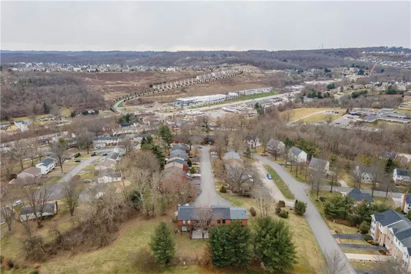 an aerial view of residential building and parking space
