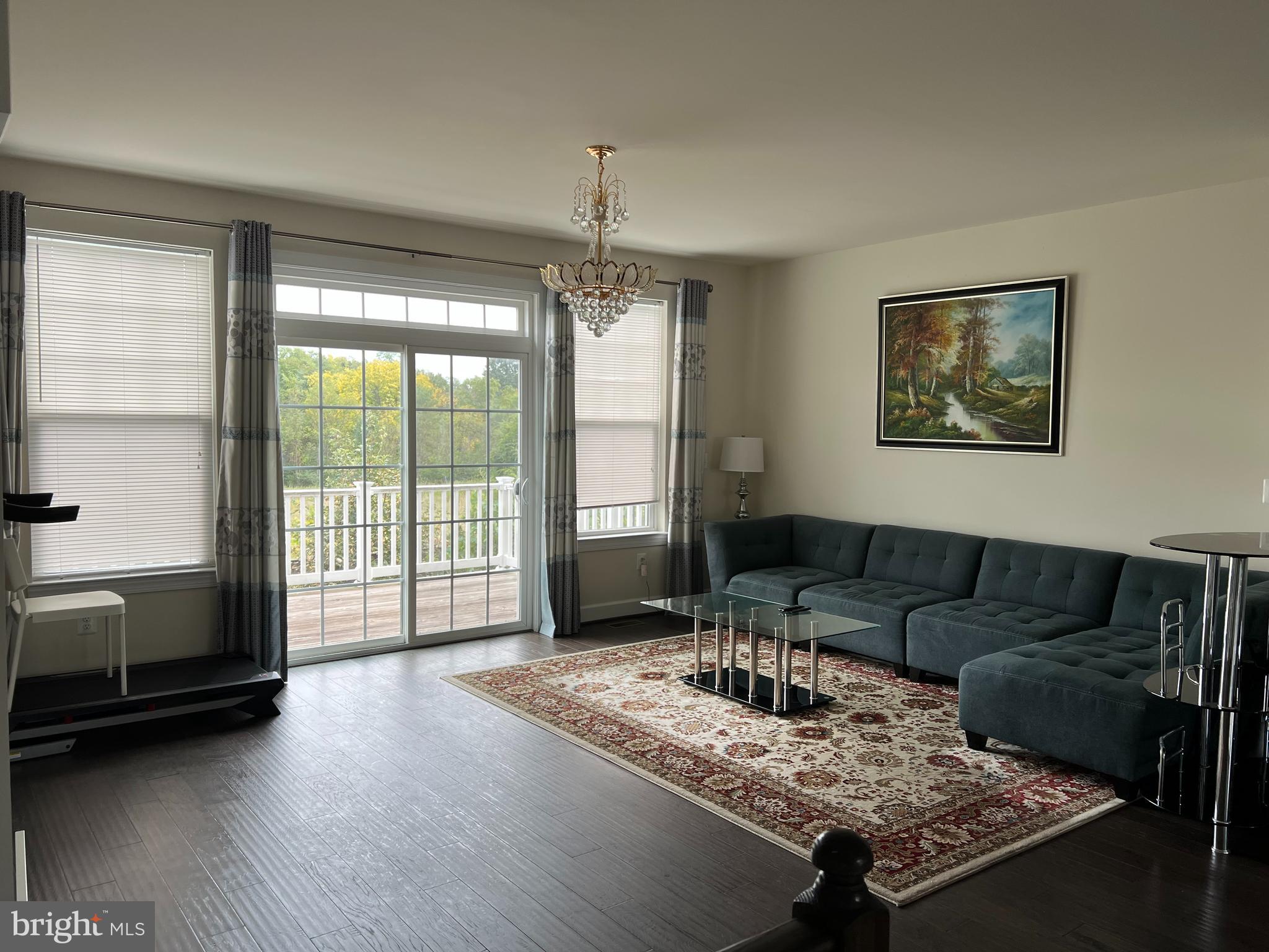 8429 Girvan Court Manassas, VA 20109 - Photo 11 of 31 a living room with furniture and a flat screen tv