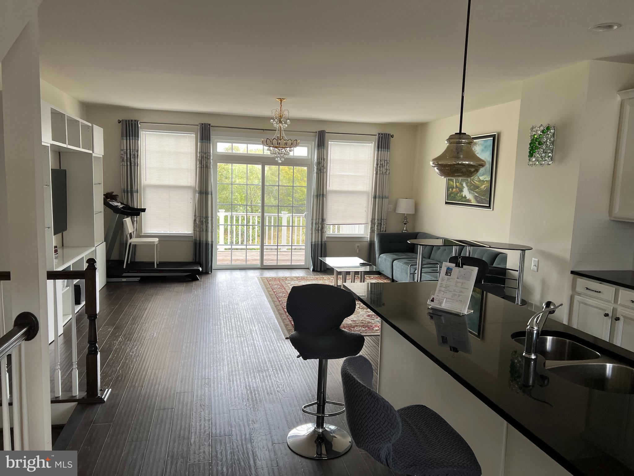 8429 Girvan Court Manassas, VA 20109 - Photo 12 of 31 a living room with furniture and a flat screen tv