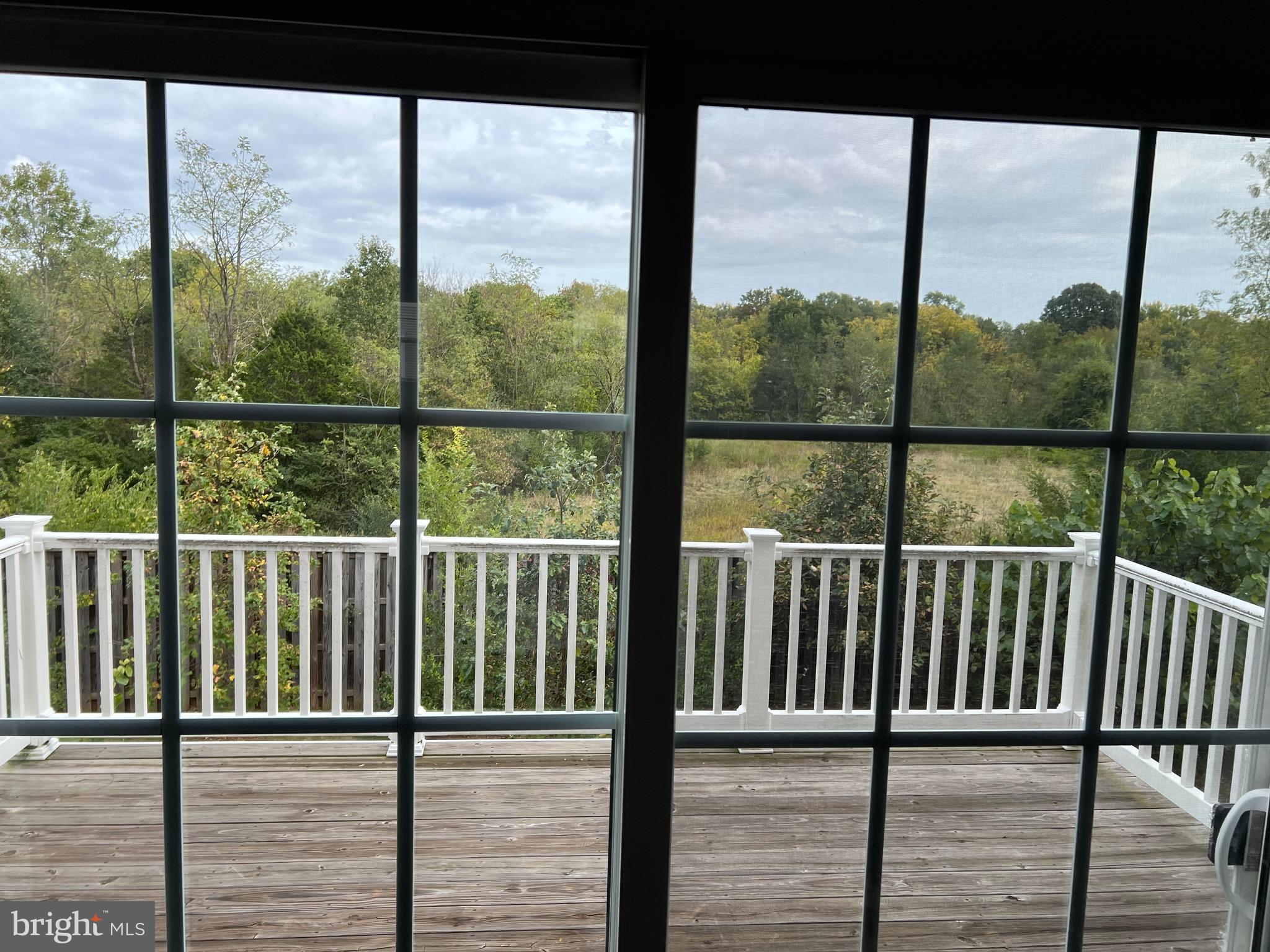 8429 Girvan Court Manassas, VA 20109 - Photo 16 of 31 a view of a balcony with wooden floor