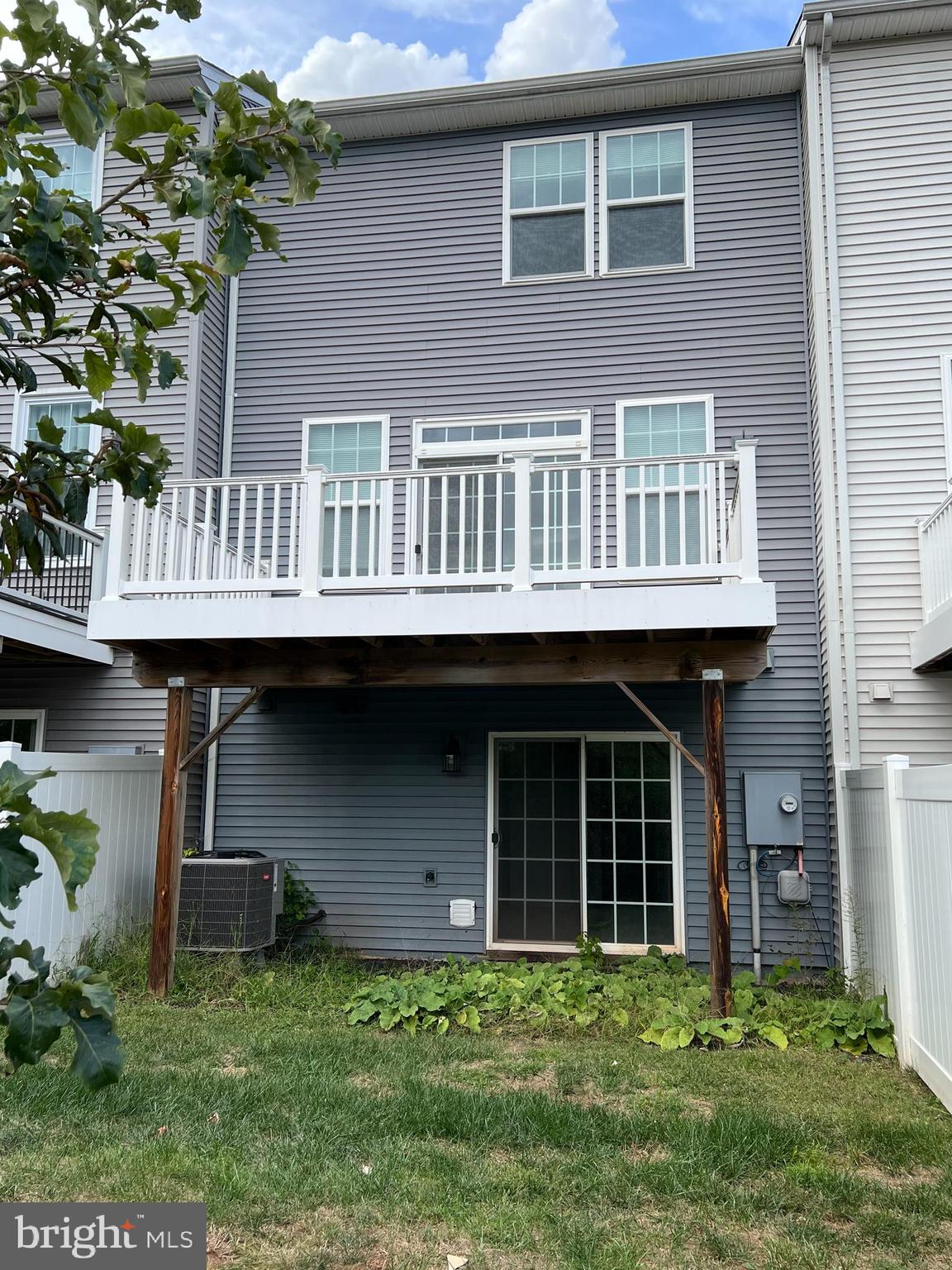 8429 Girvan Court Manassas, VA 20109 - Photo 2 of 31 a front view of a house with a yard