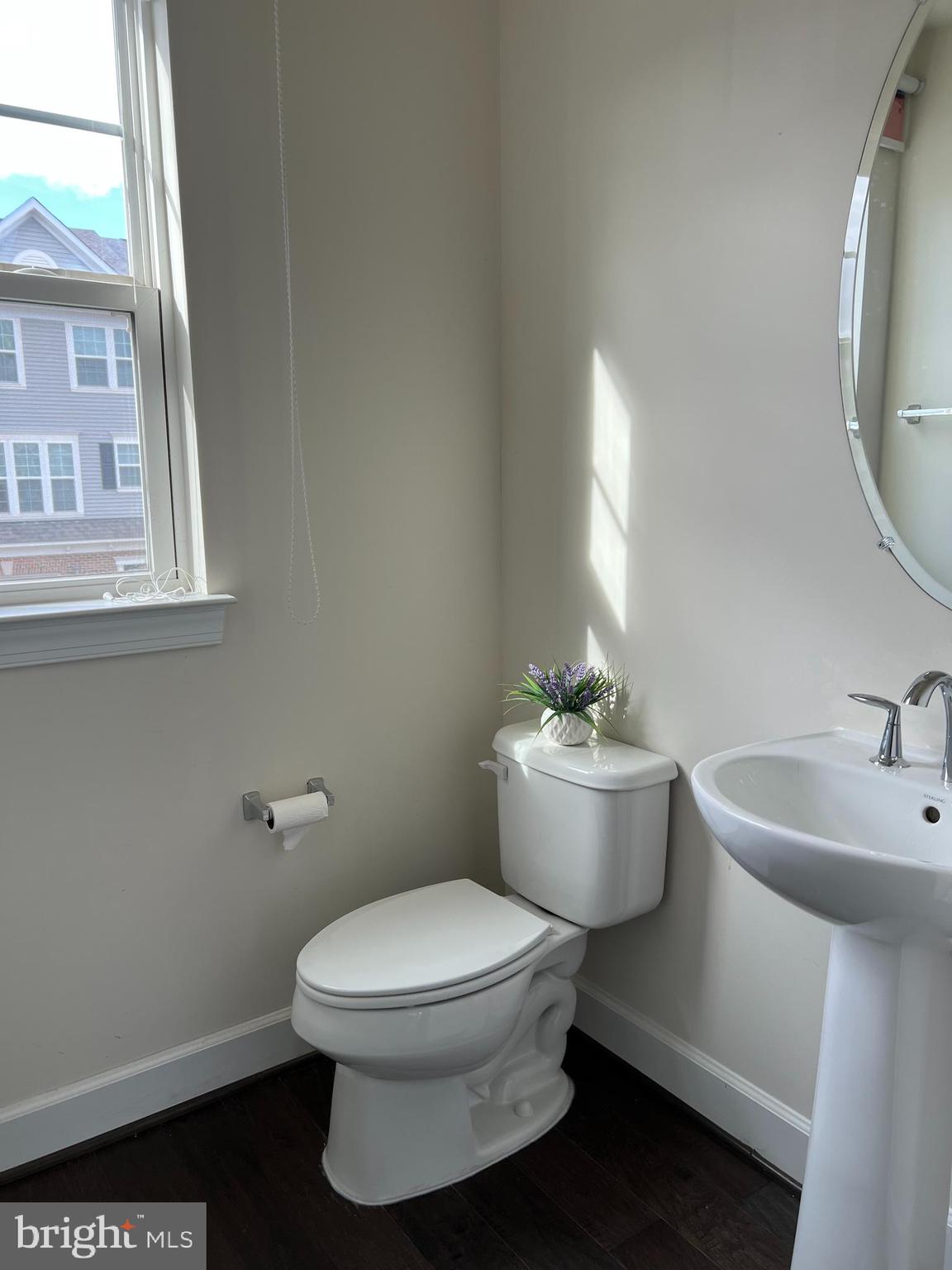 8429 Girvan Court Manassas, VA 20109 - Photo 21 of 31 a white toilet sitting next to a bathroom sink