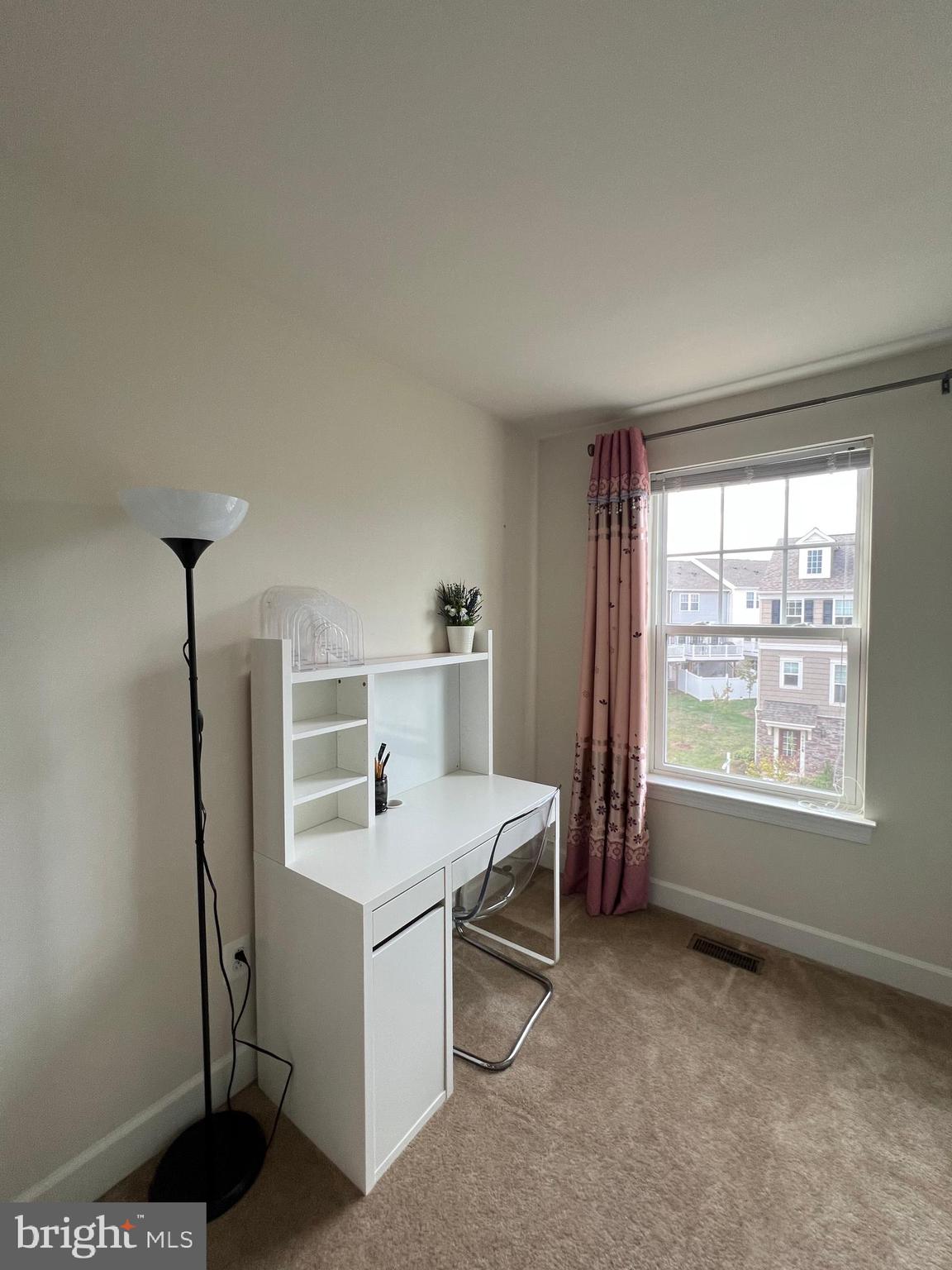 8429 Girvan Court Manassas, VA 20109 - Photo 27 of 31 a room with a bed and a window