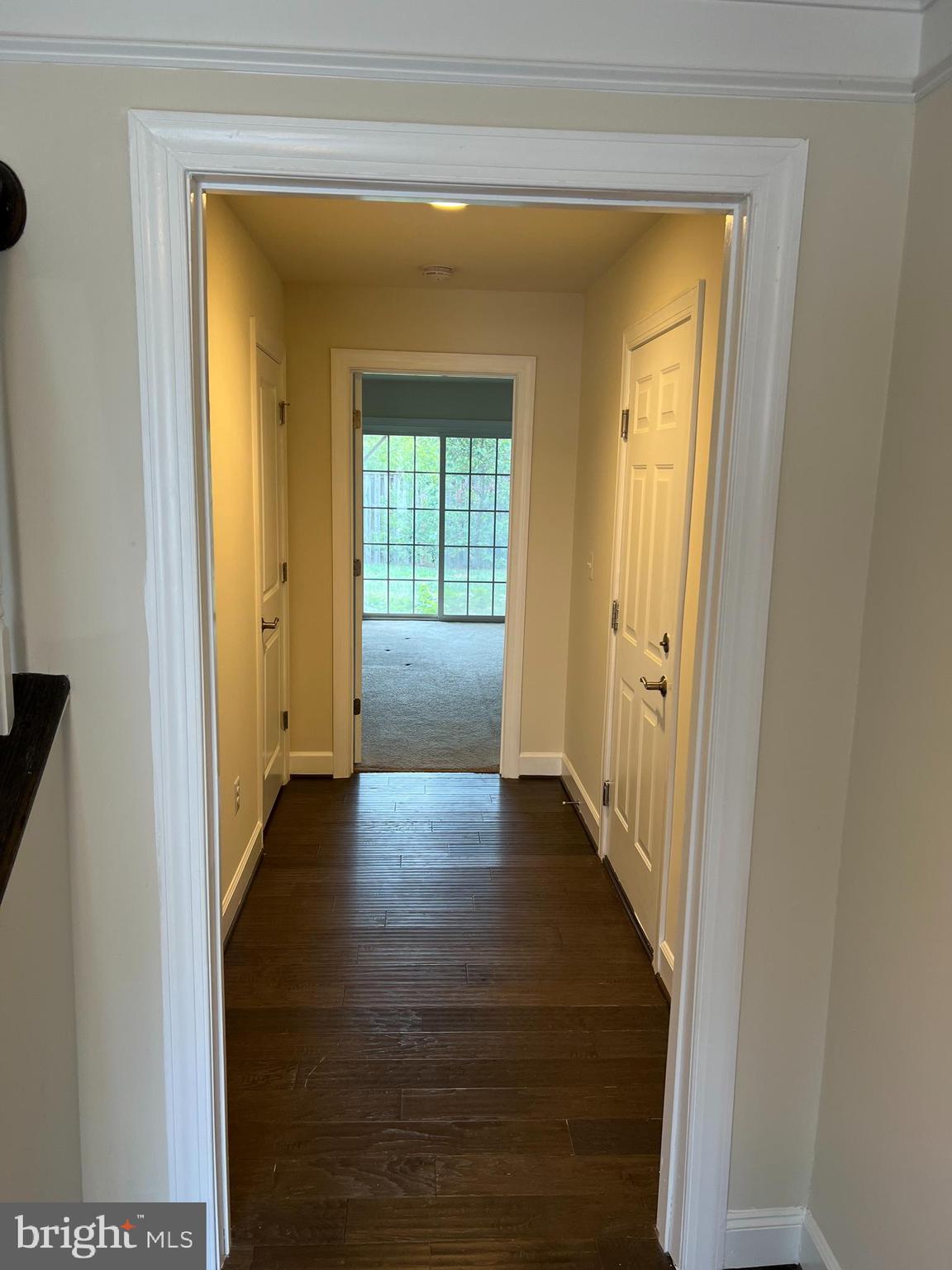 8429 Girvan Court Manassas, VA 20109 - Photo 5 of 31 a view of a hallway with wooden floor and closet