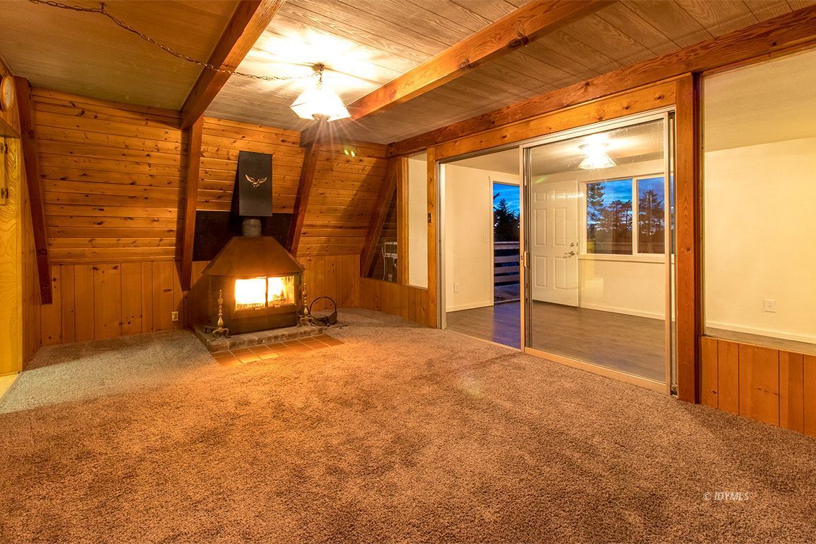 24625 Rocky Point Road Idyllwild, CA 92549 - Photo 9 of 34 a view of a room with wooden floor and windows