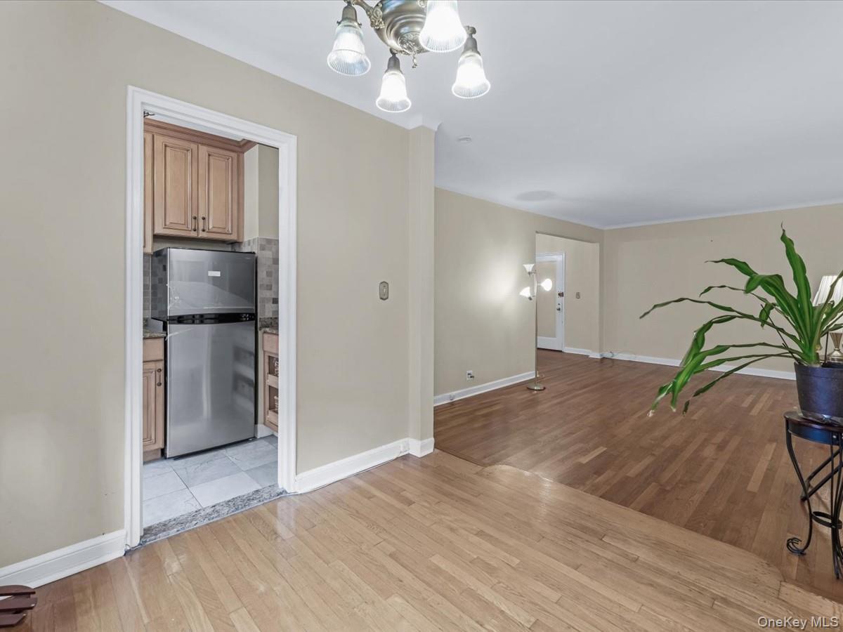 11034 73rd Road, Unit 4F Queens, NY 11375 - Photo 12 of 24 a view of a room with wooden floor and entryway