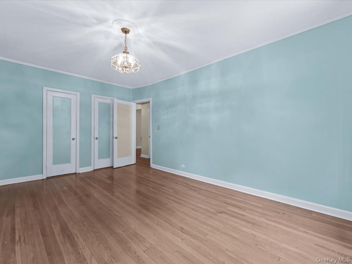 11034 73rd Road, Unit 4F Queens, NY 11375 - Photo 17 of 24 a view of an empty room with wooden floor