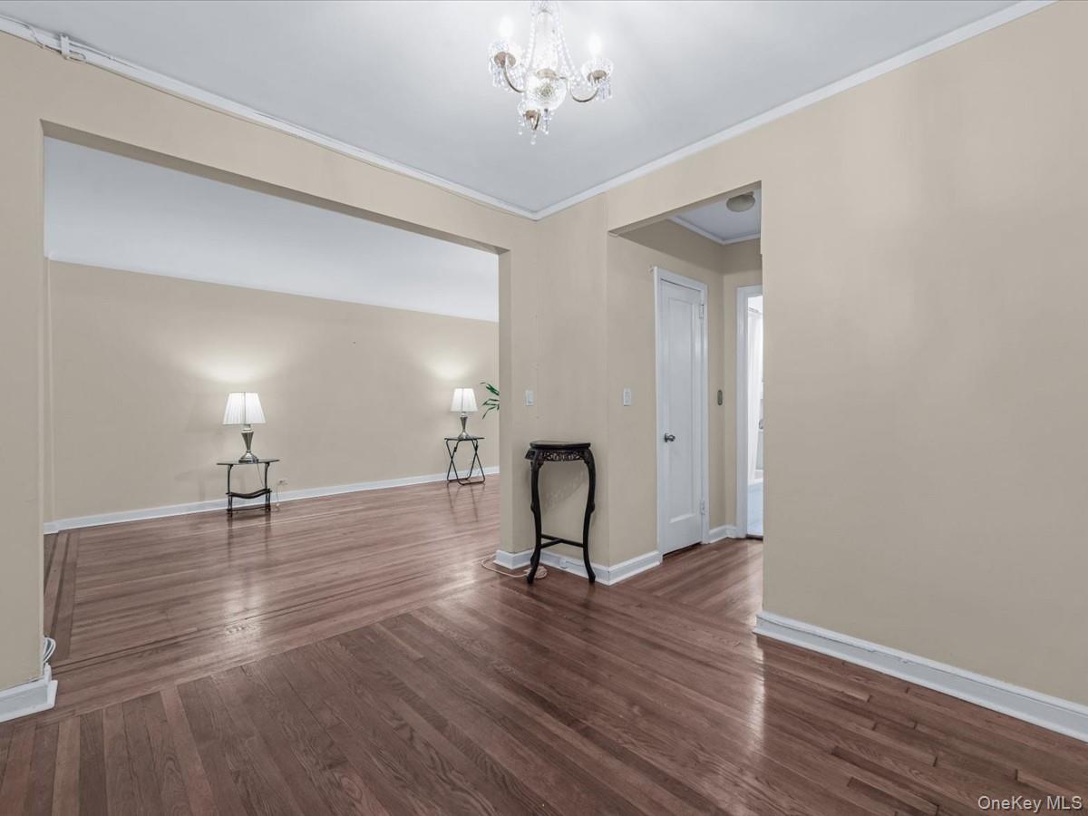 11034 73rd Road, Unit 4F Queens, NY 11375 - Photo 6 of 24 a view of empty room with wooden floor and fan