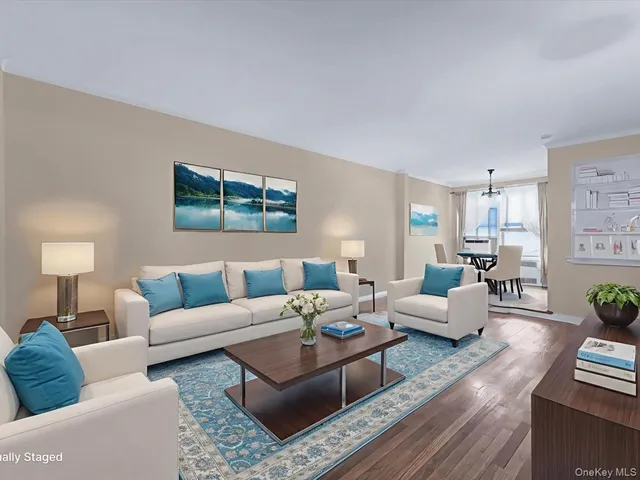 a living room with furniture potted plant and a lamp