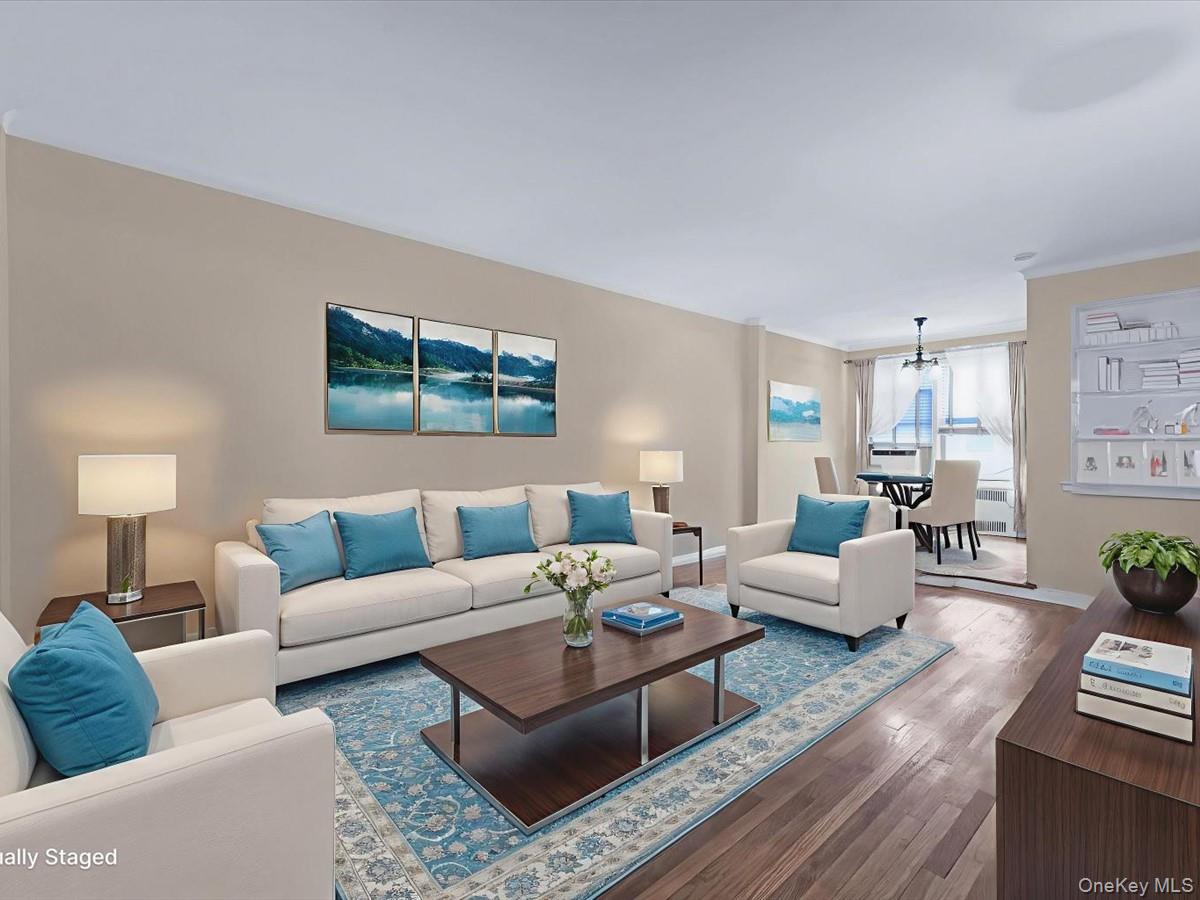 11034 73rd Road, Unit 4F Queens, NY 11375 - Photo 8 of 24 a living room with furniture potted plant and a lamp