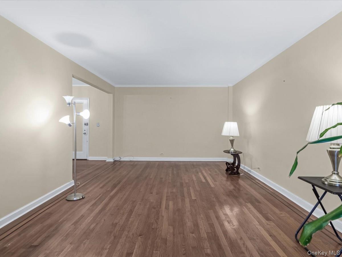 11034 73rd Road, Unit 4F Queens, NY 11375 - Photo 10 of 24 a view of empty room with wooden floor and fan