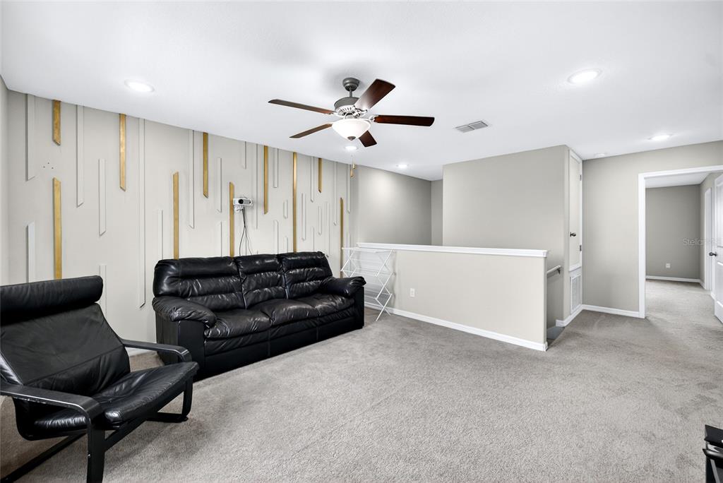 31724 Sun Kettle Loop Wesley Chapel, FL 33545 - Photo 31 of 49 a living room with furniture