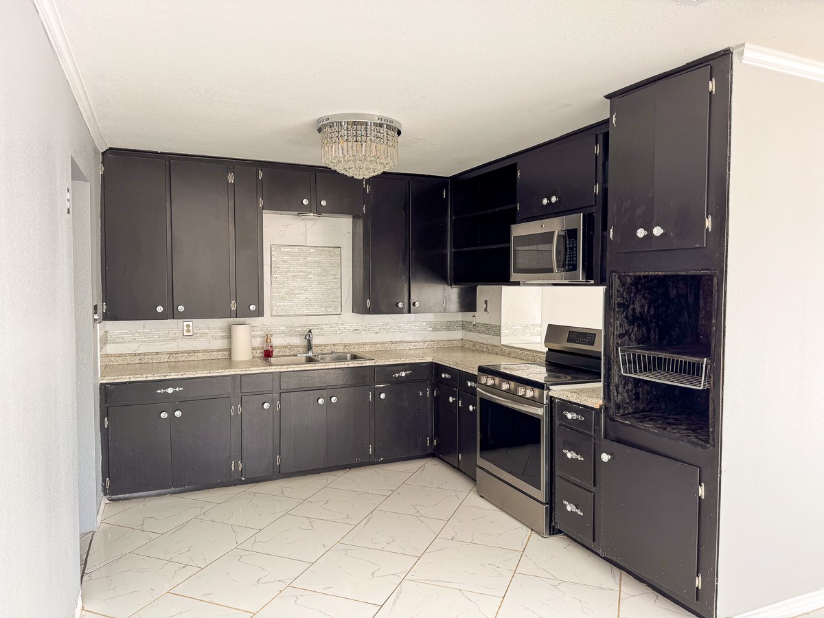 1 Fm 328 Huntington, TX 75949 - Photo 23 of 40 a kitchen with stainless steel appliances granite countertop a sink and cabinets