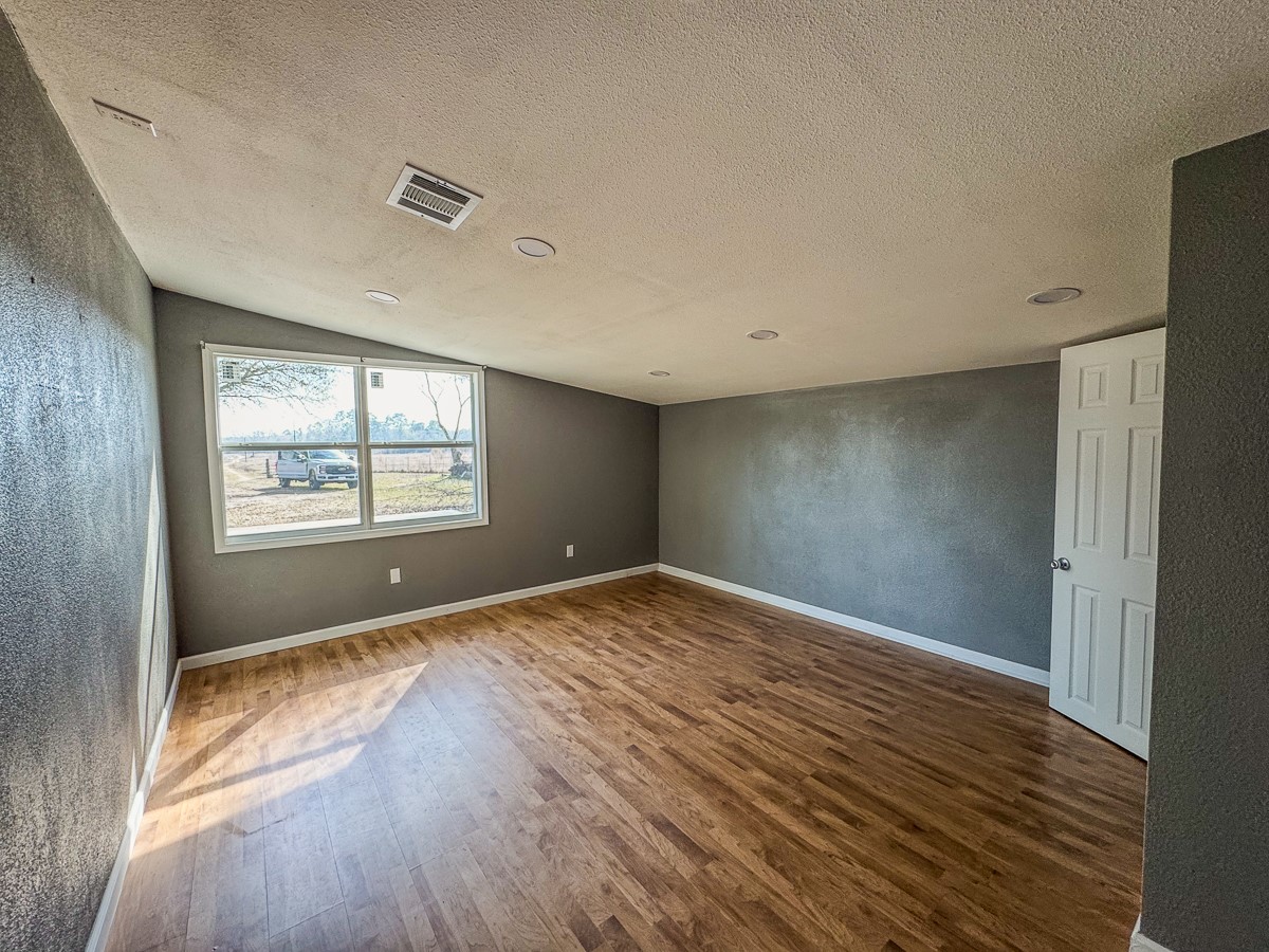 1 Fm 328 Huntington, TX 75949 - Photo 25 of 40 a view of an empty room with wooden floor and a window