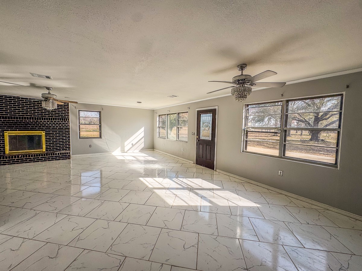 1 Fm 328 Huntington, TX 75949 - Photo 29 of 40 a view of an empty room with a fireplace and a window