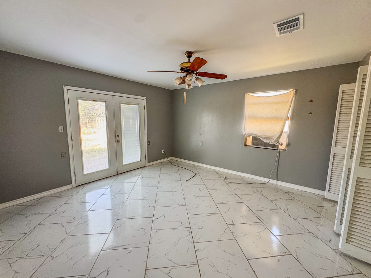 1 Fm 328 Huntington, TX 75949 - Photo 31 of 40 an empty room with windows and fan