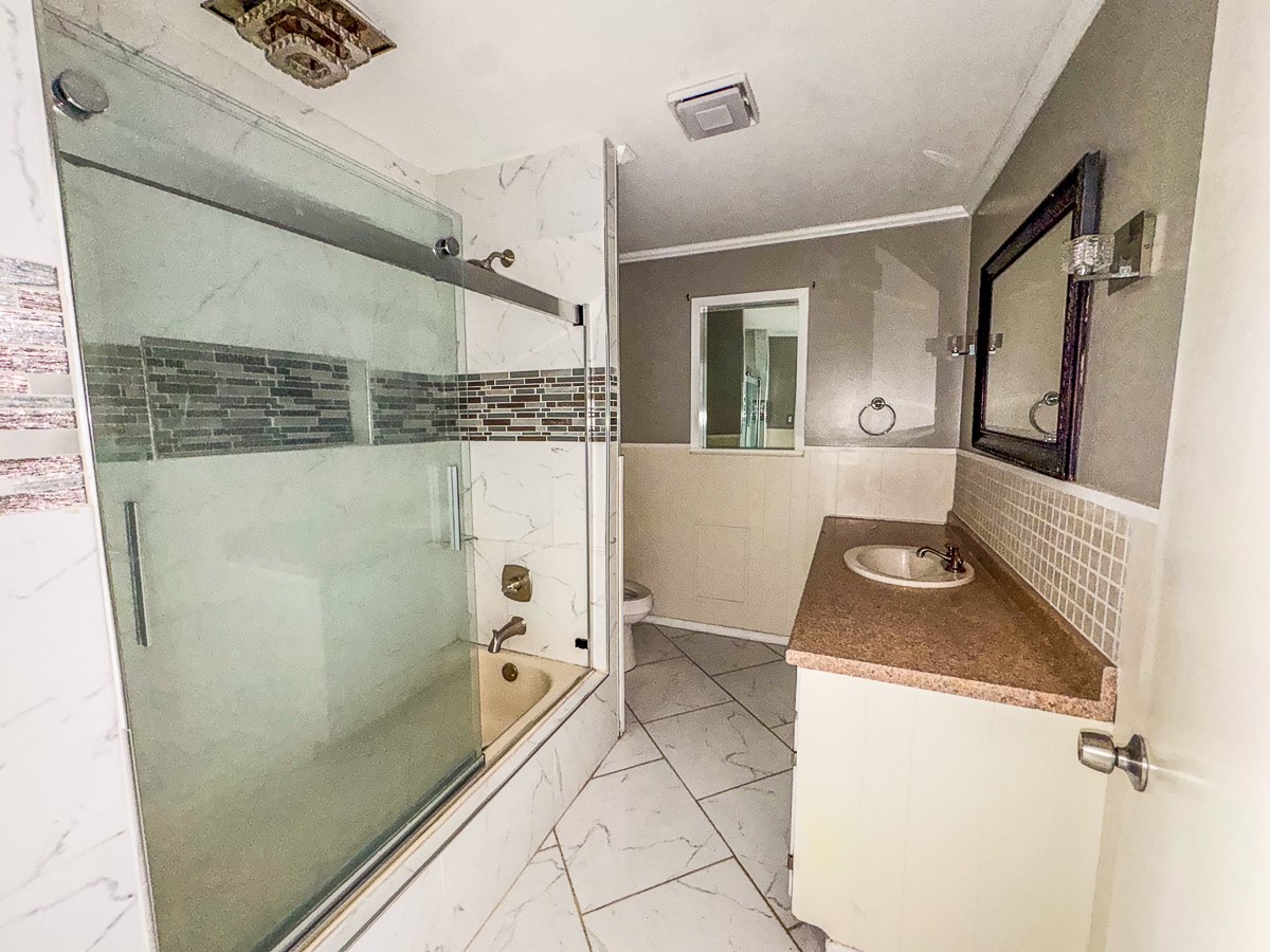1 Fm 328 Huntington, TX 75949 - Photo 32 of 40 a bathroom with a granite countertop sink and a mirror