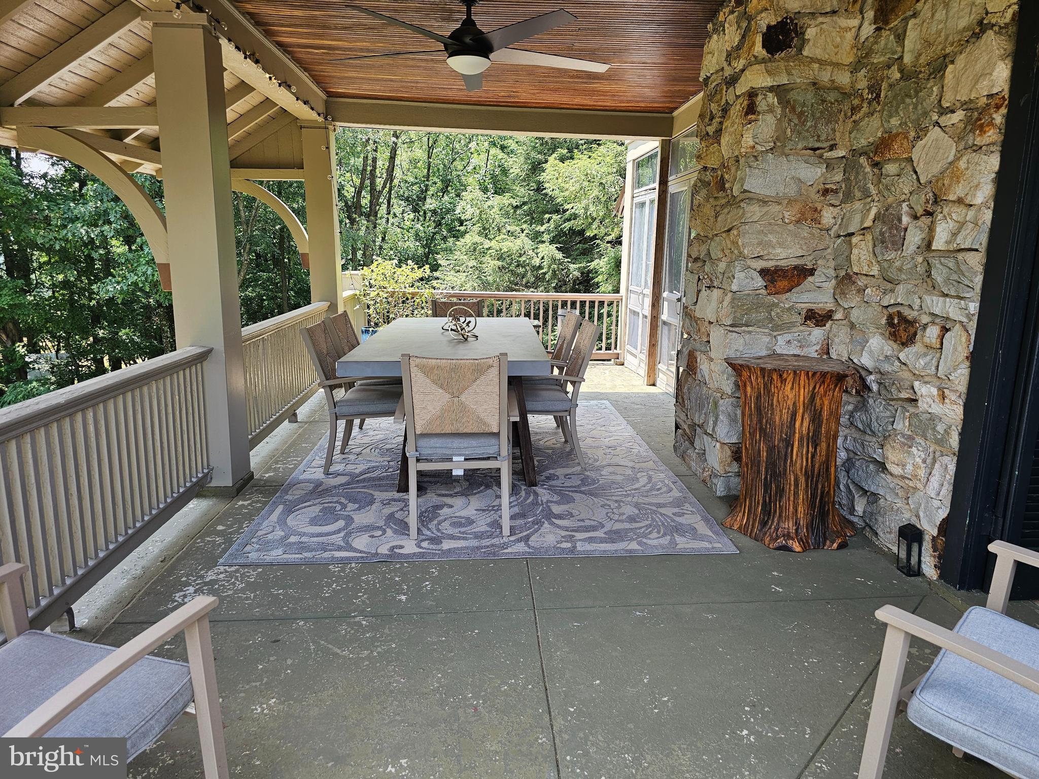 13245 Buena Vista Road Waynesboro, PA 17268 - Photo 12 of 54 Side porch with beautiful stone/wood accents