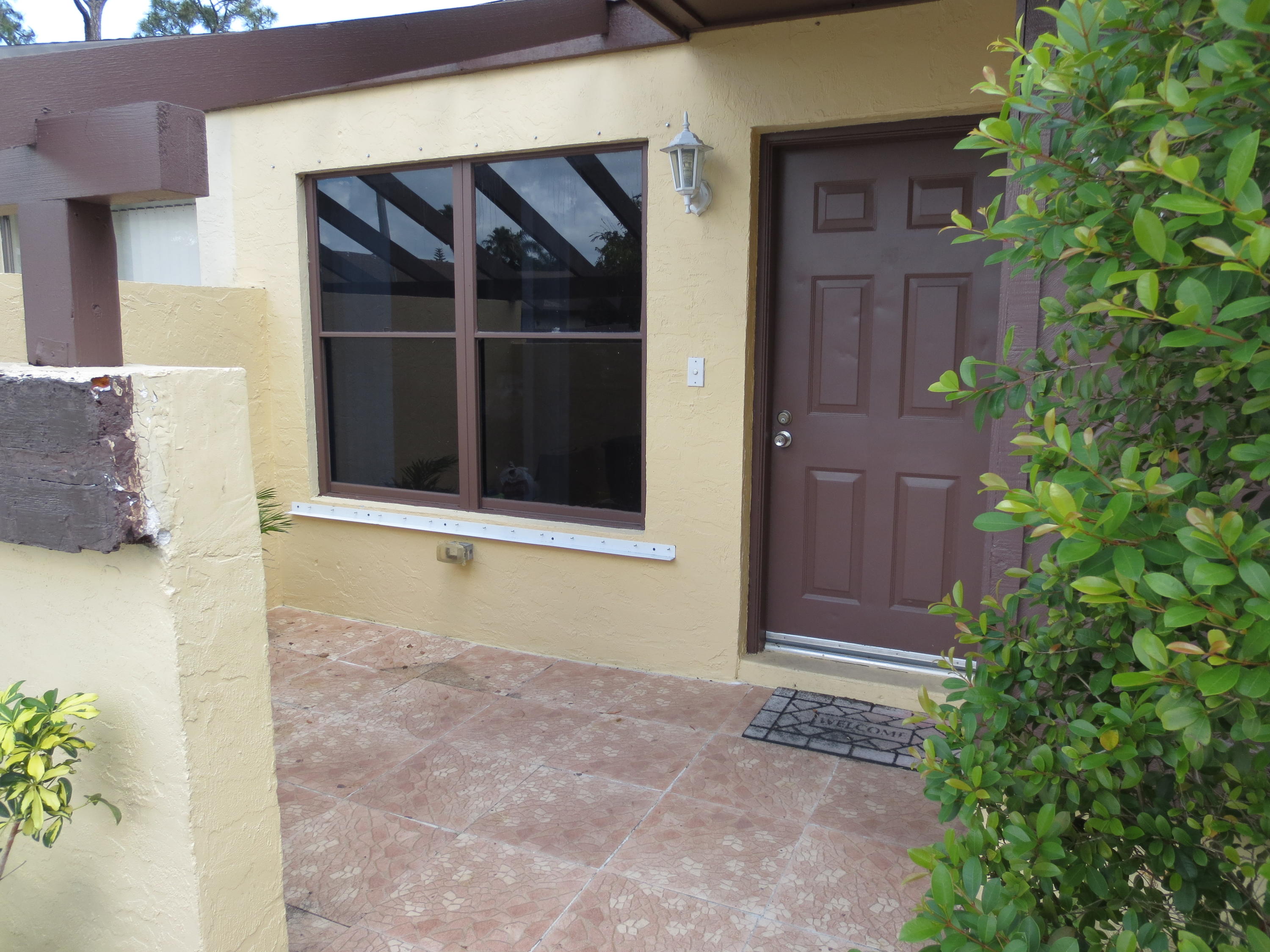 3768 Mil-Stream Court Greenacres, FL 33463 - Photo 32 of 36 a view of entrance gate of the house