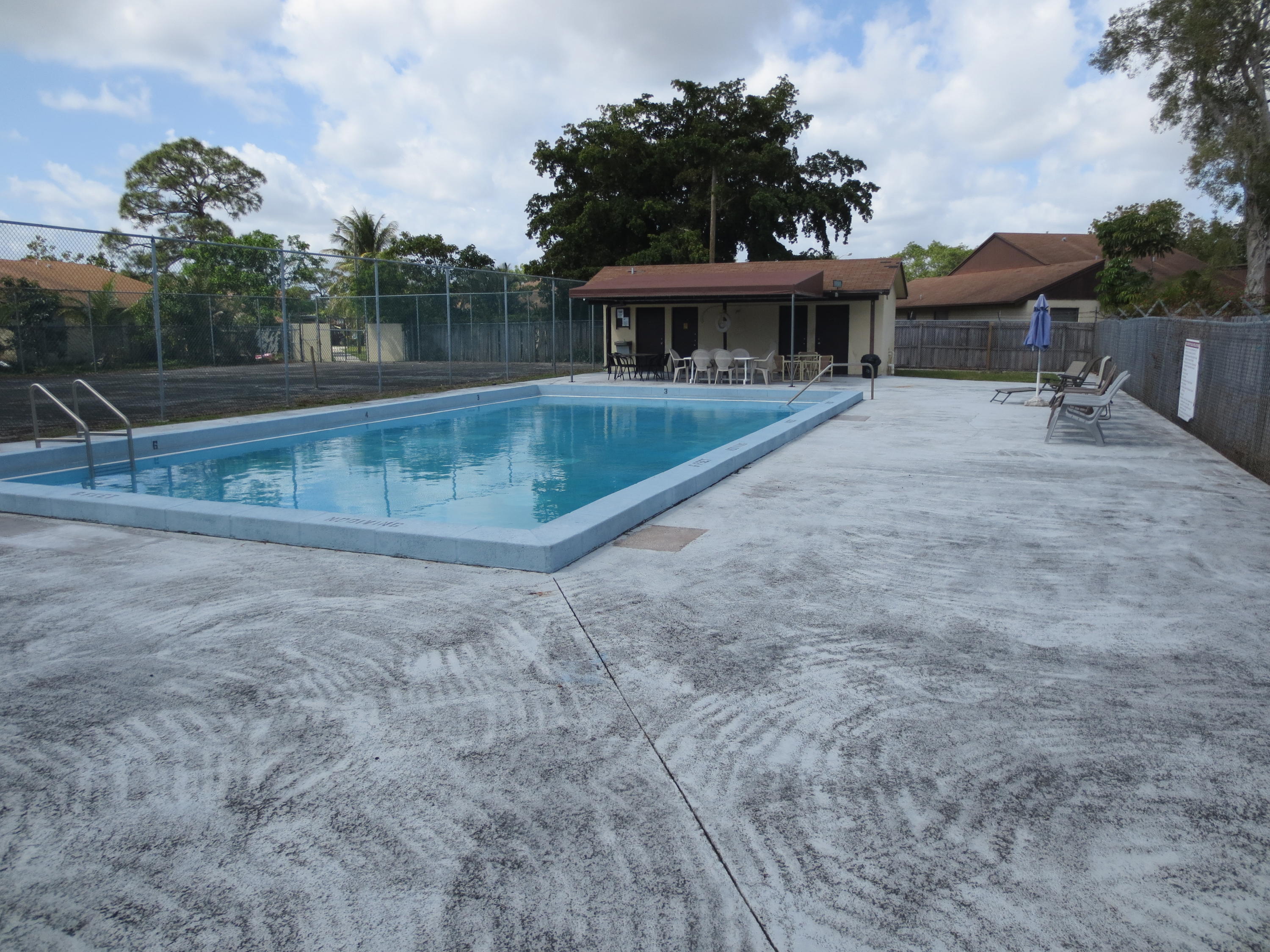 3768 Mil-Stream Court Greenacres, FL 33463 - Photo 36 of 36 an outdoor space with swimming pool and furniture