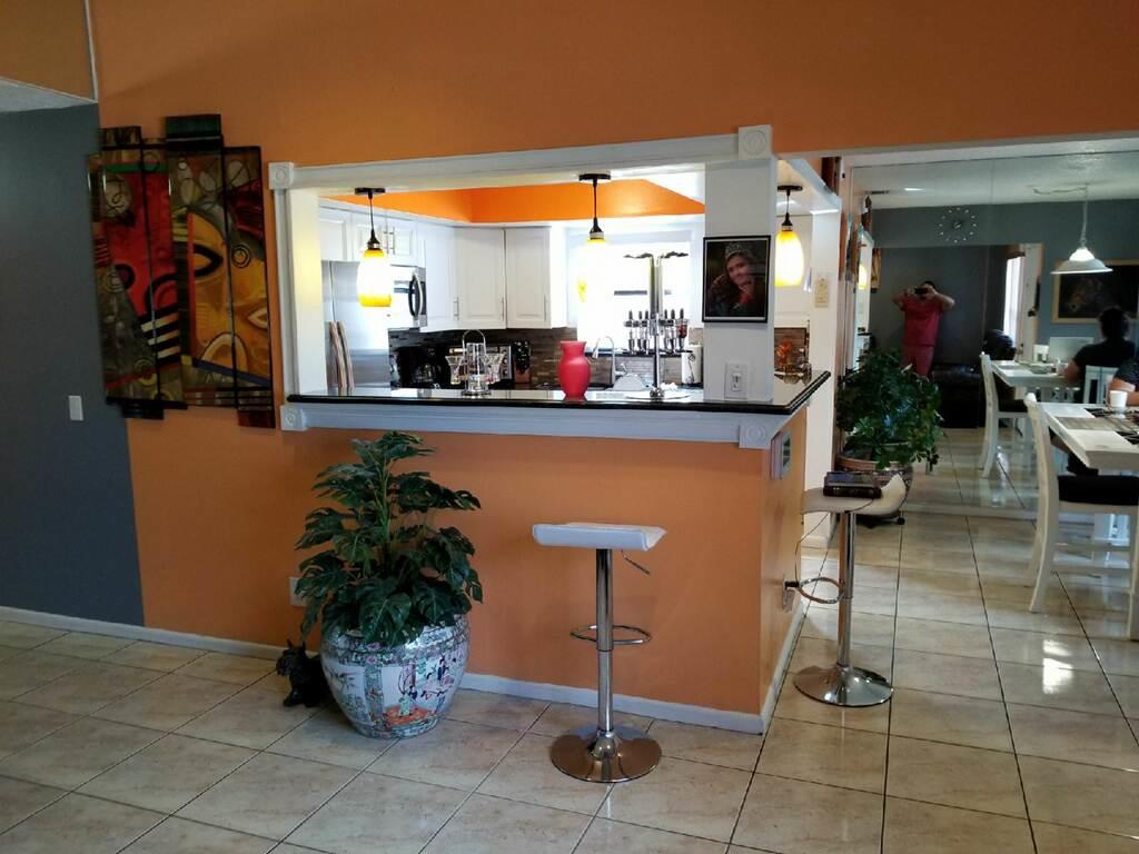 3768 Mil-Stream Court Greenacres, FL 33463 - Photo 6 of 36 a kitchen with a sink a counter and cabinets