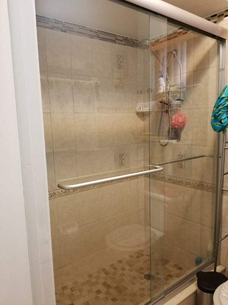 3768 Mil-Stream Court Greenacres, FL 33463 - Photo 8 of 36 a bathroom with a shower