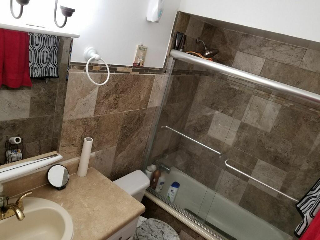 3768 Mil-Stream Court Greenacres, FL 33463 - Photo 9 of 36 a bathroom with a sink and a toilet