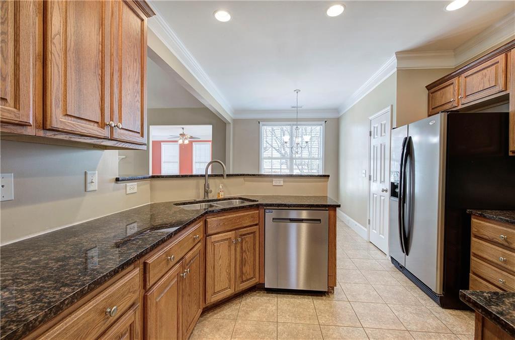 29 Autumn Street Northwest Cartersville, GA 30121 - Photo 12 of 31 a kitchen with stainless steel appliances granite countertop a sink stove and refrigerator