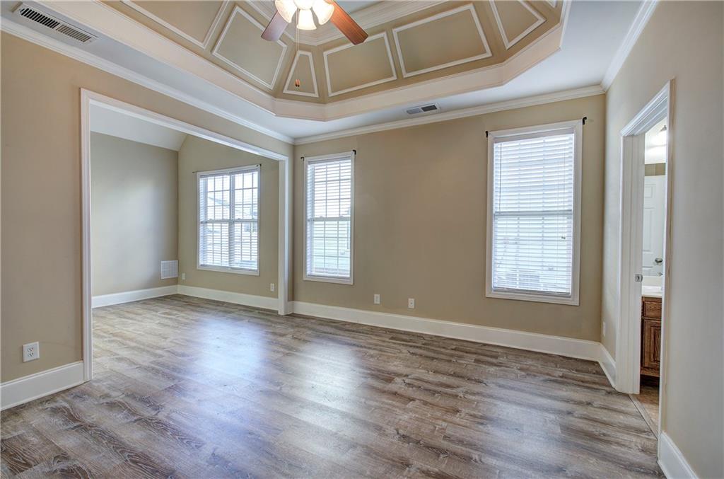 29 Autumn Street Northwest Cartersville, GA 30121 - Photo 18 of 31 a view of an empty room with wooden floor and a window