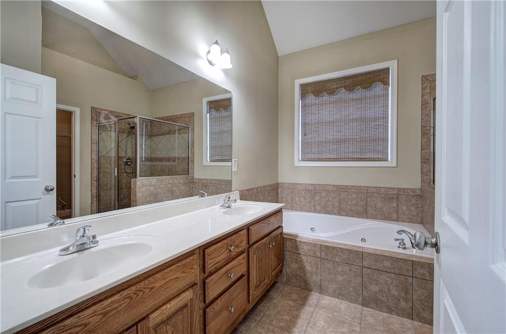 29 Autumn Street Northwest Cartersville, GA 30121 - Photo 20 of 31 a bathroom with a tub double vanity sink and mirror