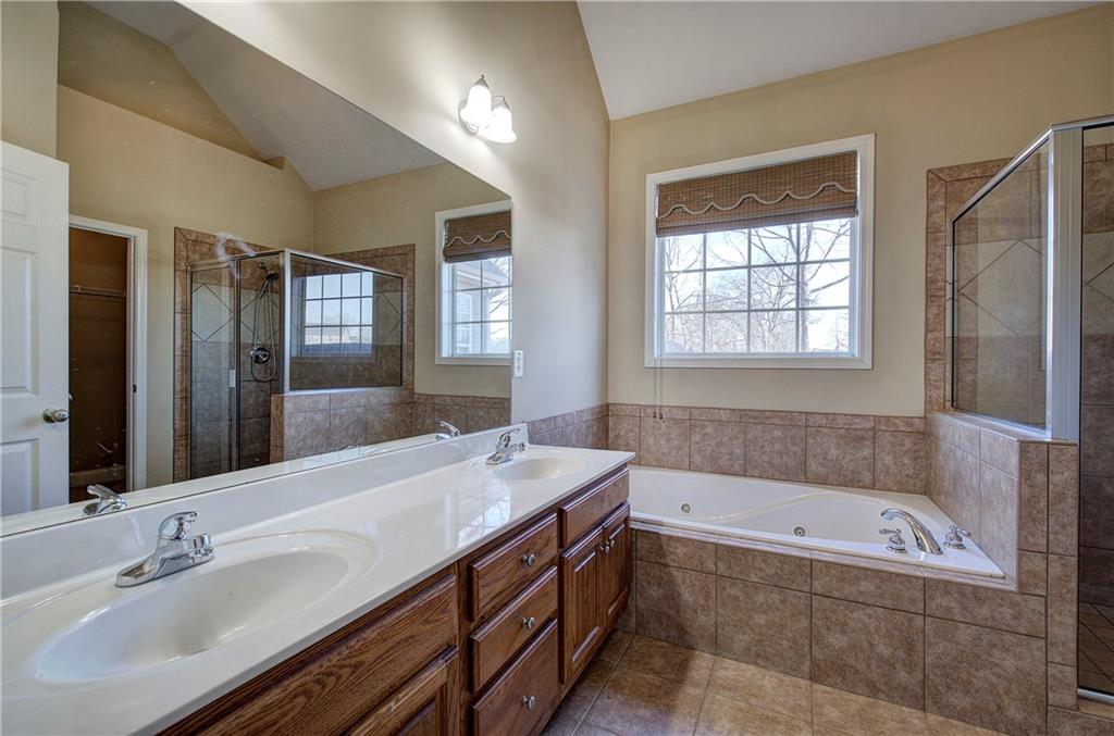 29 Autumn Street Northwest Cartersville, GA 30121 - Photo 21 of 31 a bathroom with a tub sink and mirror