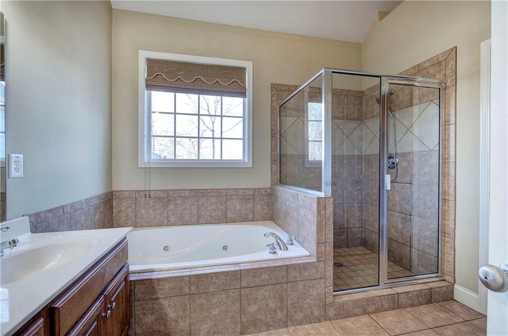 29 Autumn Street Northwest Cartersville, GA 30121 - Photo 22 of 31 a bathroom with a bath tub and a shower