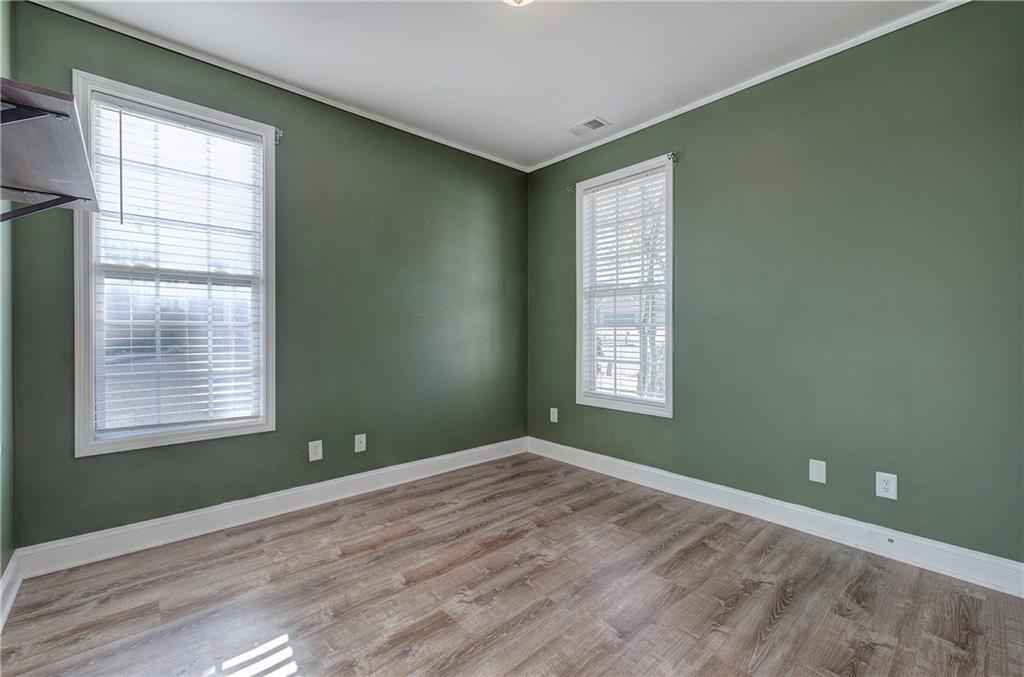 29 Autumn Street Northwest Cartersville, GA 30121 - Photo 23 of 31 a view of an empty room with wooden floor and a window