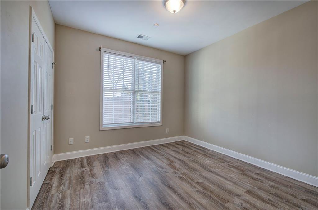 29 Autumn Street Northwest Cartersville, GA 30121 - Photo 25 of 31 wooden floor in an empty room with a window