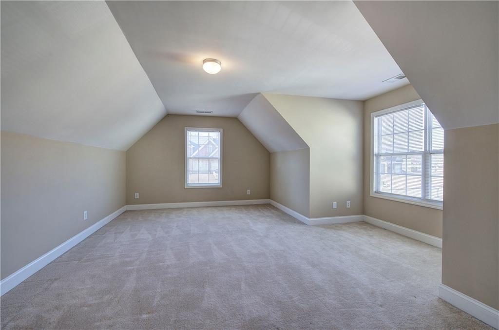 29 Autumn Street Northwest Cartersville, GA 30121 - Photo 27 of 31 an empty room with windows