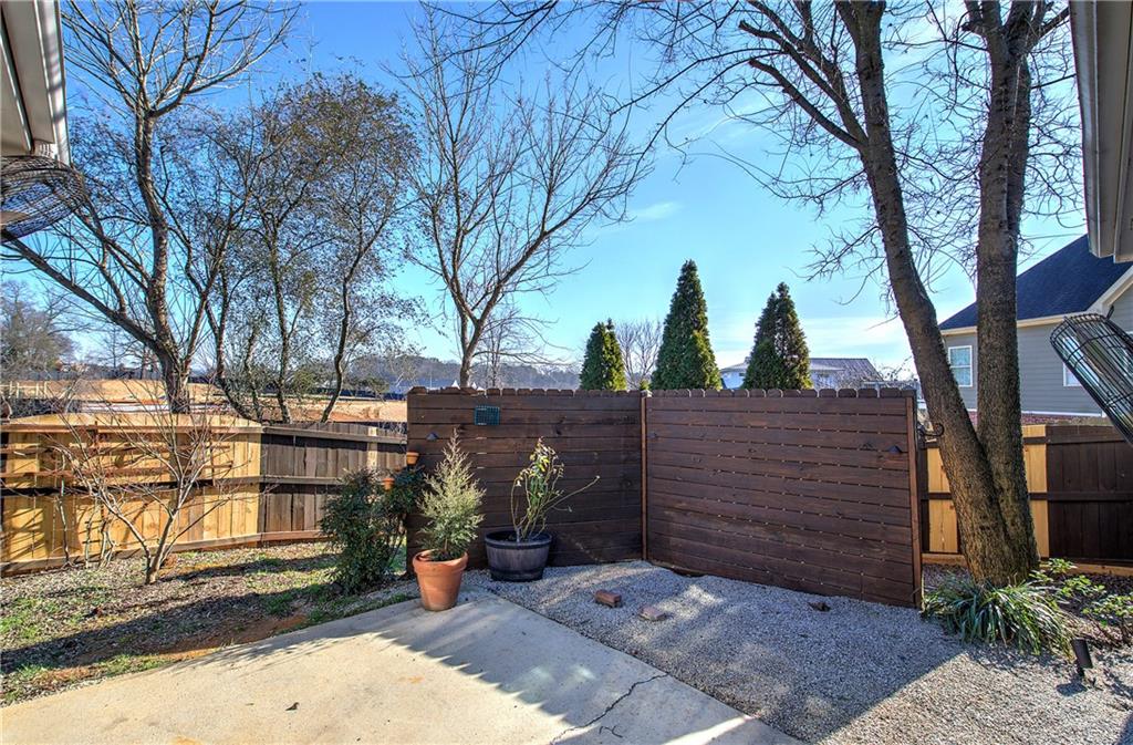 29 Autumn Street Northwest Cartersville, GA 30121 - Photo 29 of 31 a view of a street with potted plants and large trees