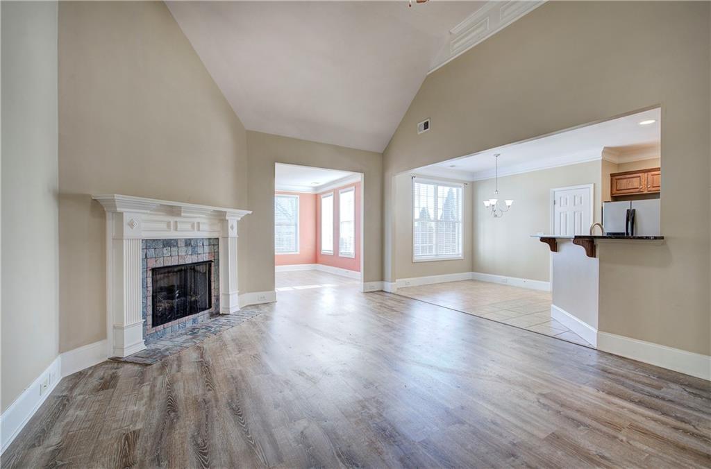 29 Autumn Street Northwest Cartersville, GA 30121 - Photo 6 of 31 a view of a room with wooden floor and fireplace