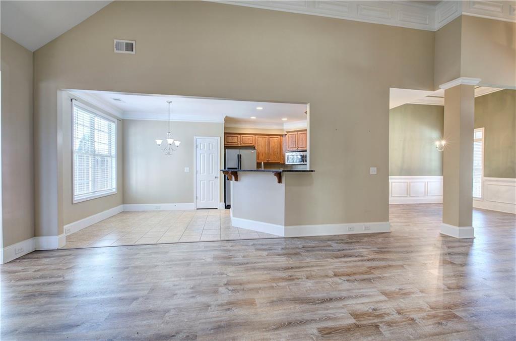 29 Autumn Street Northwest Cartersville, GA 30121 - Photo 7 of 31 a view of a livingroom with wooden floor and a kitchen