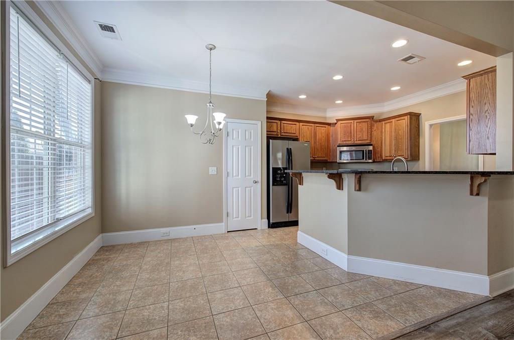 29 Autumn Street Northwest Cartersville, GA 30121 - Photo 9 of 31 a view of a kitchen with microwave and refrigerator