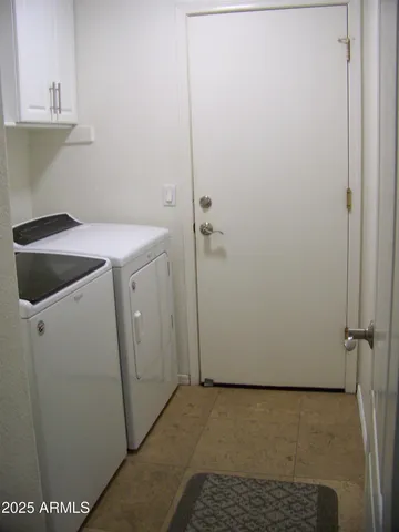 a bathroom with a sink and cabinets