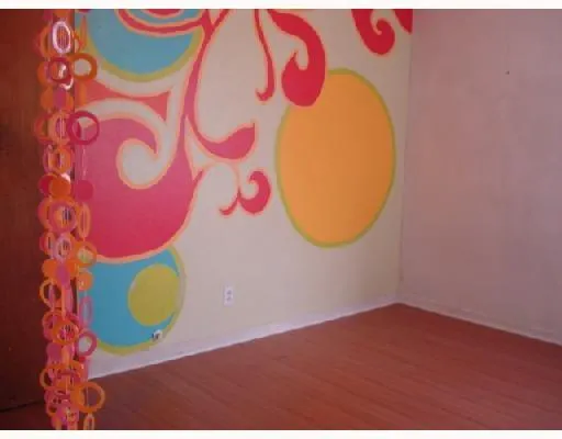 a view of a wooden floor with a book shelf