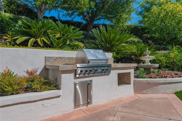 a view of a patio with a table chairs and backyard