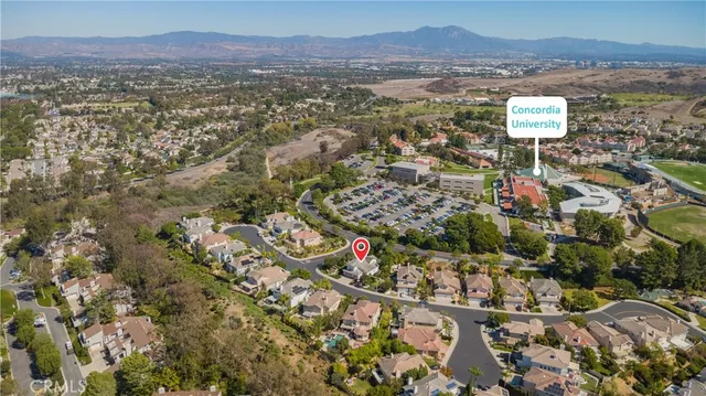 an aerial view of residential house and sandy dunes