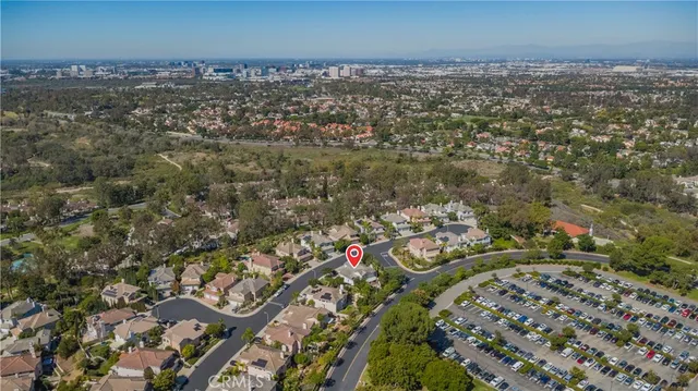 an aerial view of residential house and sandy dunes