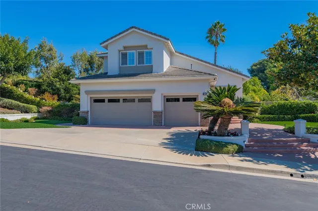 a house that has a tree in front of it