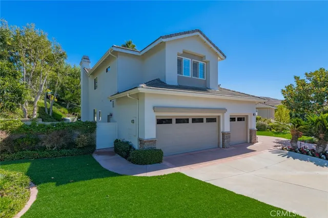 a view of a pathway both side of house