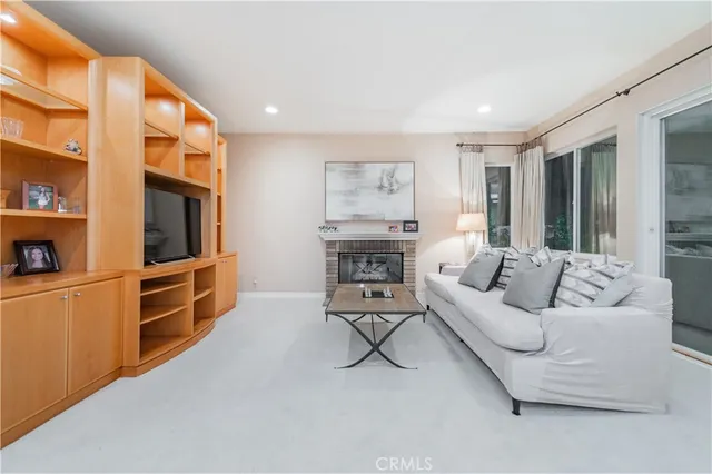 a kitchen with stainless steel appliances kitchen island granite top and refrigerator
